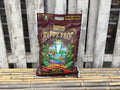 Small Bag of Happy Frog potting soil on a wooden surface at Paisley Gardens in Northfield, MN.