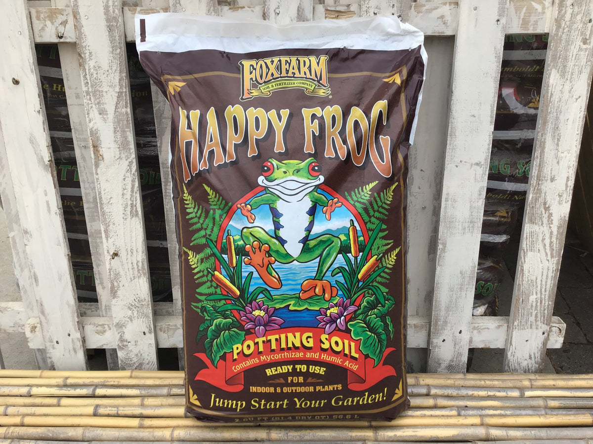 Bag of Fox Farm Happy Frog potting soil on a wooden background at Paisley Gardens in Northfield, MN.