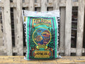 Bag of Fox Farm Ocean Forest potting soil against a wooden background at Paisley Gardens in Northfield, MN.